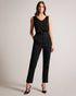 SHAVON-Tops-Step up your casual style with this must-have slouchy vest. SHAVON's V-neck and low back provide a comfortable, relaxed fit, while the sleeveless design makes it perfect for layering. The eye-catching embroidered magnolia and contrast stitching add a touch of charm, and the stretch fabric promises all-day comfort. Slouchy vest Rounded V-neck Low back Sleeveless Embroidered magnolia Stretch fabric Contrast stitching Amy is 5'9.5" / 1.77m and wears Black in a Ted size 1- Ted Baker Romania